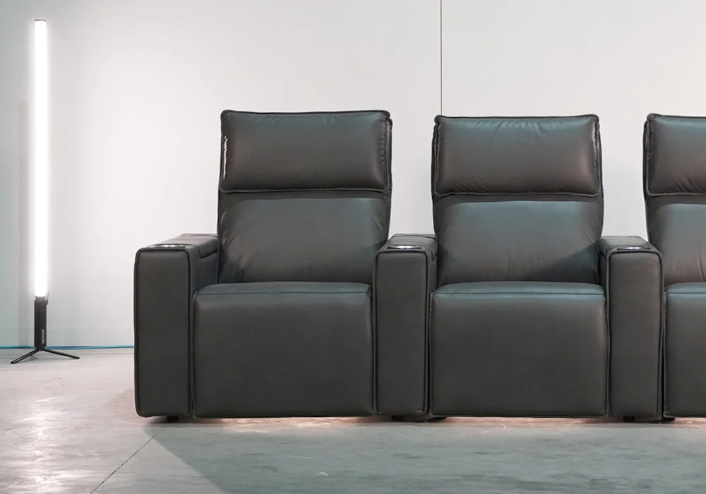 Smart Comfort dark leather home theatre seating with cupholder armrests